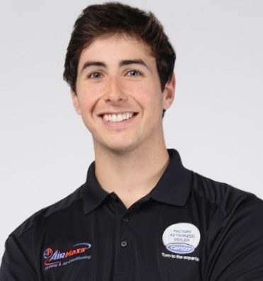 David Glozman, AirMaxx HVAC Manager, in a branded company shirt