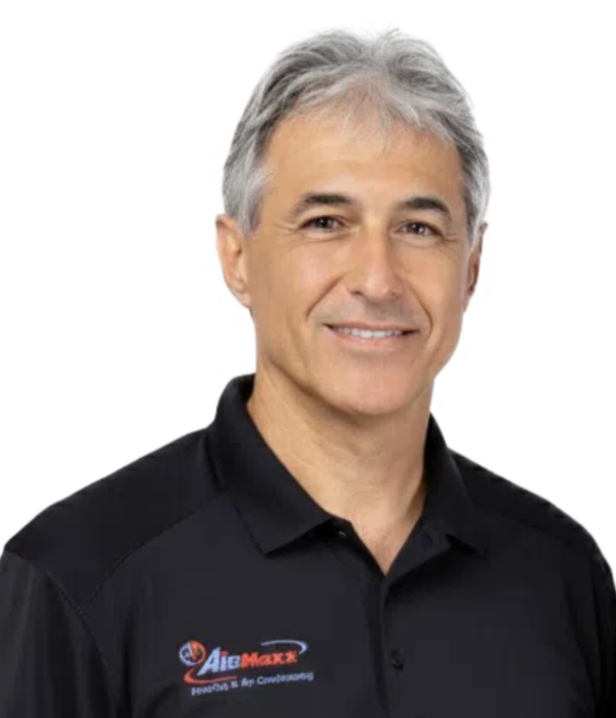 Alex Glozman, AirMaxx HVAC Owner, in a branded company shirt